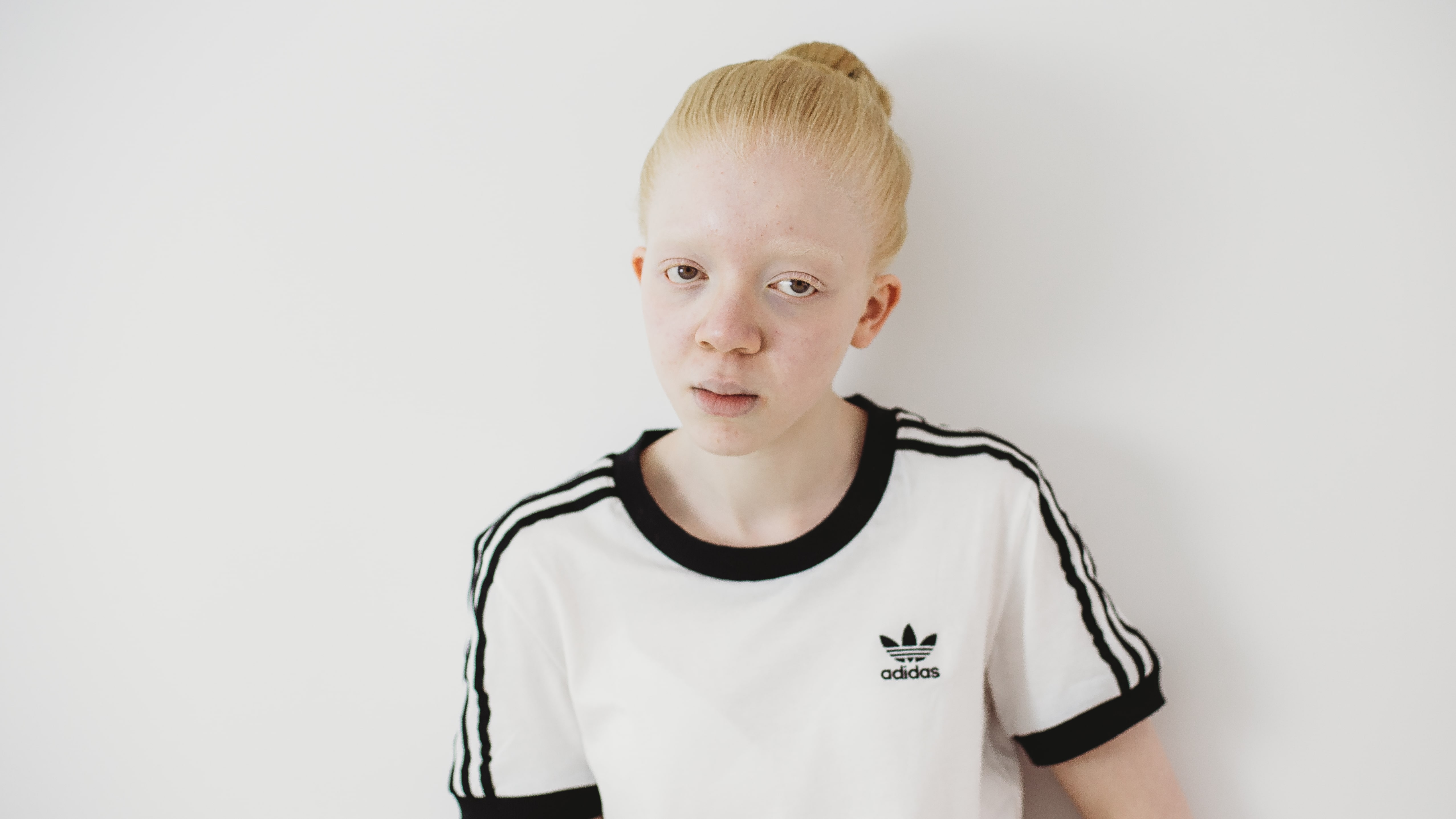 portrait of girl in white adidas shirt